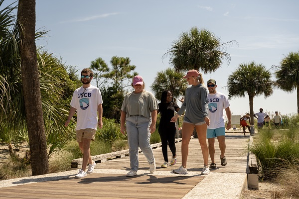 Group of Students on Beach Boardwalk